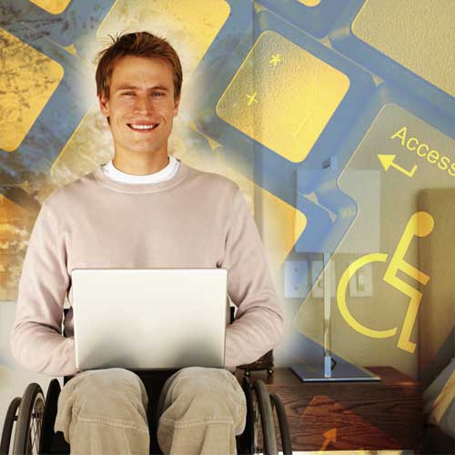 a photo of a young guy with a laptop using a wheelchair
