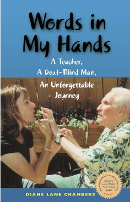 an image of the Words in Hands: A Teacher, A Deaf-Blind Man, An Unforgettable Journey featuring a woman h olding an elderly man's hands