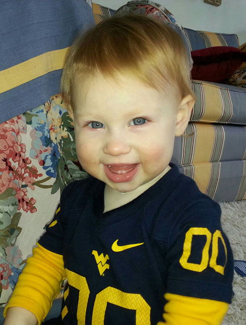 Rebekah Aranda's infant daughter in a WVU jersey