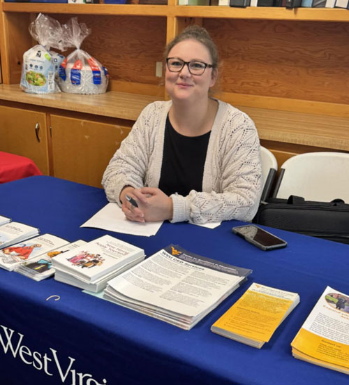 Kacee Givens at her table