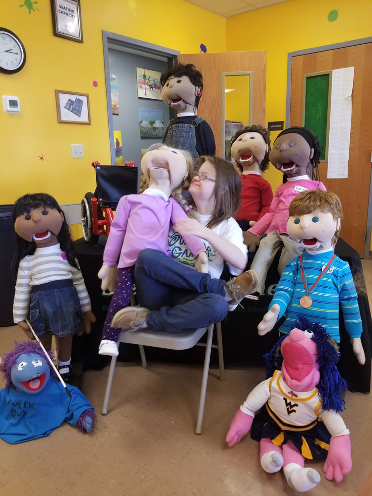 Collection of diverse disability awareness puppets used for education and engagement